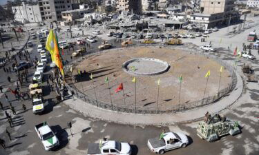 Female fighters of the Syrian Democratic Forces (SDF) gather during a celebration at the iconic Al-Naim square in Raqqa on October 19