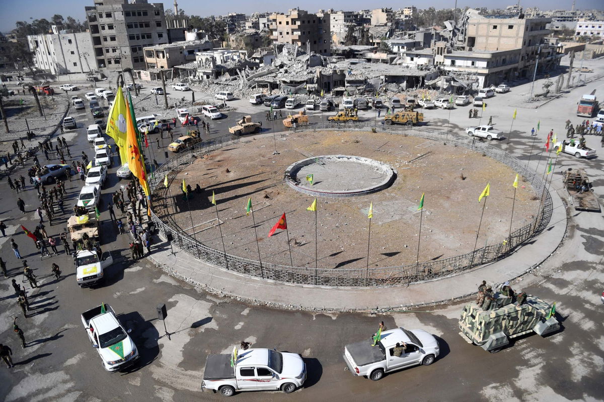 <i>BULENT KILIC/AFP/Getty Images</i><br/>Female fighters of the Syrian Democratic Forces (SDF) gather during a celebration at the iconic Al-Naim square in Raqqa on October 19