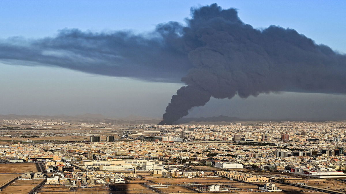 <i>ANDREJ ISAKOVIC/AFP via Getty Images</i><br/>Smoke billows from an oil storage facility in Saudi Arabia's Red Sea coastal city of Jeddah on March 25.