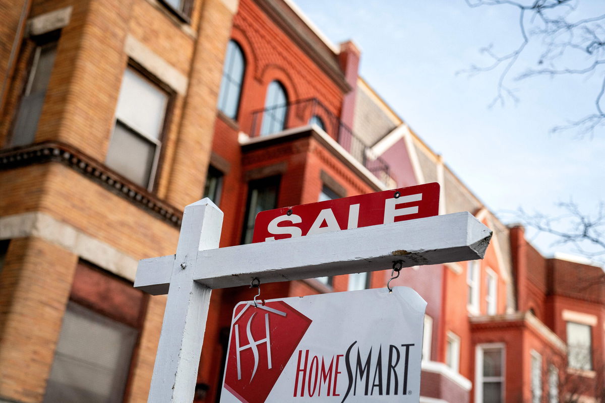 <i>Stefani Reynolds/AFP/Getty Images</i><br/>A For Sale sign is displayed in front of a house in Washington