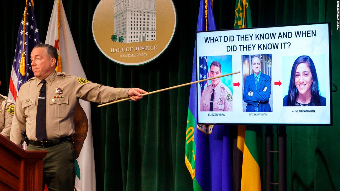 Los Angeles County Sheriff Alex Villanueva gestures during a news conference, Tuesday, April 26, 2022, in Los Angeles. Villanueva disputed allegations that he orchestrated the coverup of an incident where a deputy knelt on a handcuffed inmate's head last year. Villanueva, who oversees the nation's largest sheriff's department, also indicated that an Los Angeles Times reporter is under criminal investigation after she first reported the incident with the inmate. (AP Photo/Damian Dovarganes)