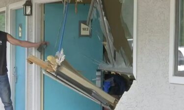 A couple is happy to be alive after a car crashed into their motel room in Mobile