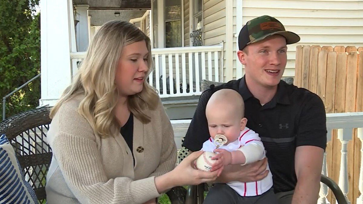 <i>WLWT</i><br/>A fan at Tuesday night's Cincinnati Reds game is going viral after catching a foul ball while having his hands full.