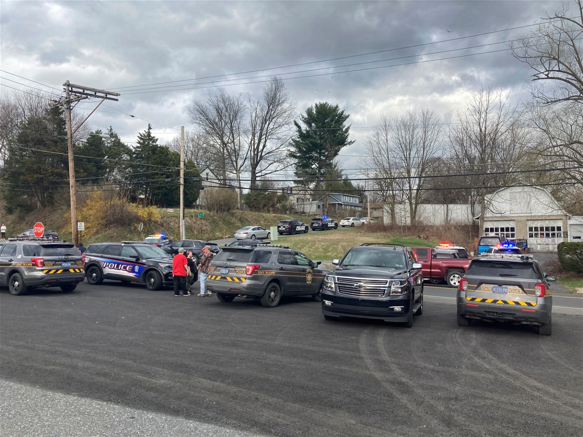 <i>Matthew Toth/Lebanon Daily News/AP</i><br/>Police gather near the scene of a fatal shooting in Lebanon