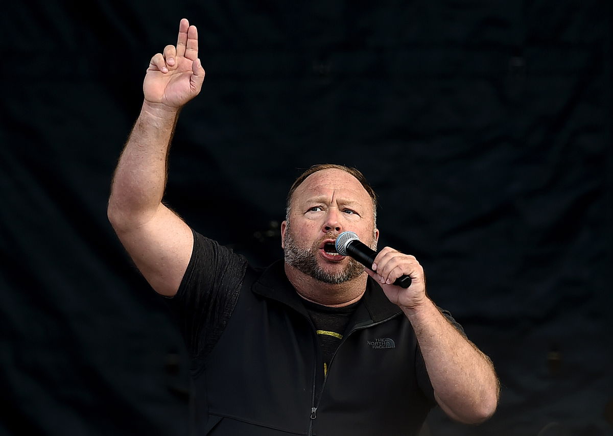 <i>Olivier Douliery/AFP/Getty Images</i><br/>A Texas judge on Monday postponed a trial that will determine how much right-wing conspiracy theorist Alex Jones will have to pay the families of two Sandy Hook shooting victims. Jones is shown here in Washington