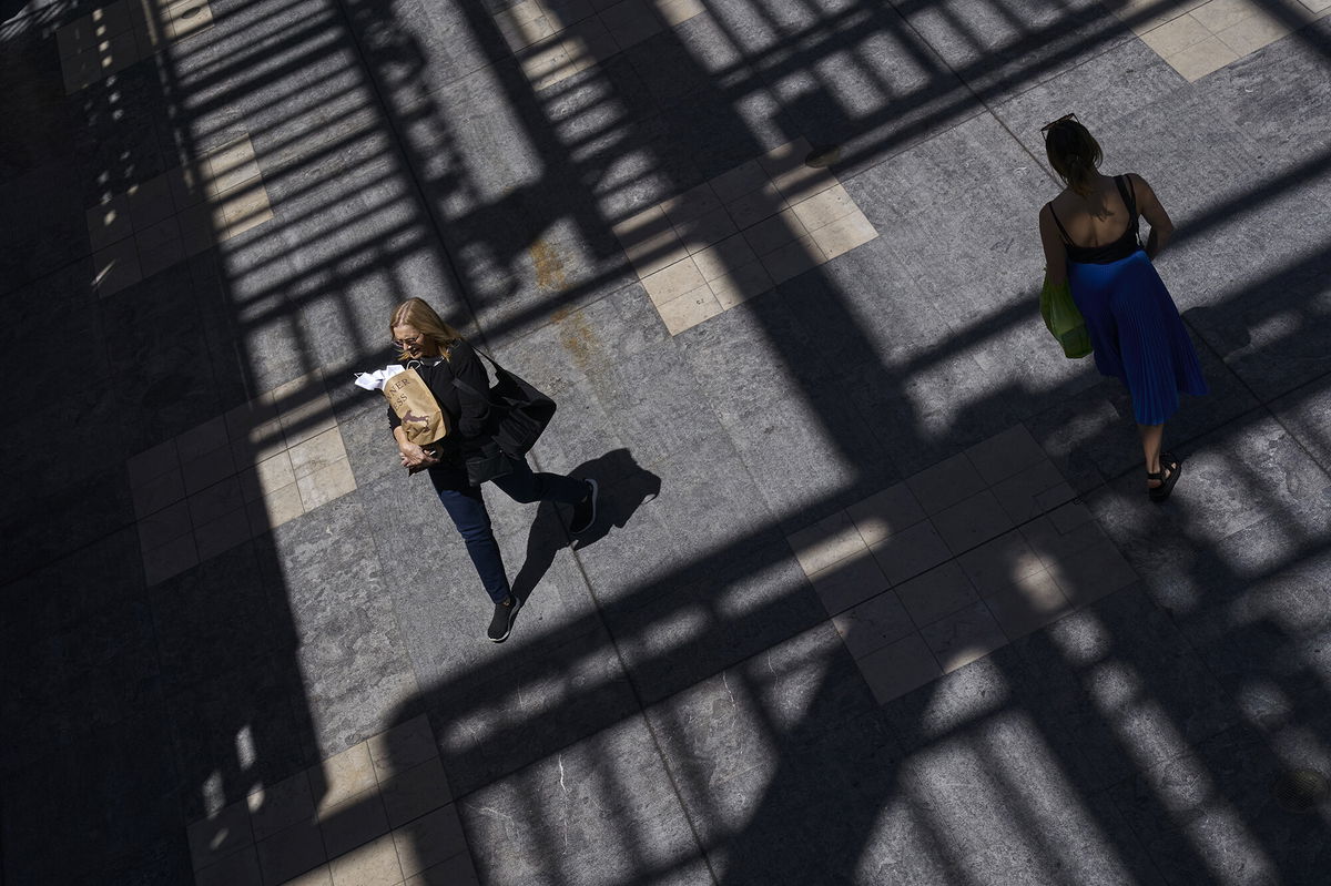 <i>Bing Guan/Bloomberg/Getty Images</i><br/>A shopper carries bags inside the Westfield Culver City shopping mall in Culver City