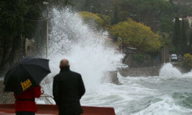 People watch the waves in Volosko