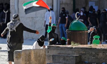 Palestinian demonstrators clash with Israeli police at Jerusalem's al-Aqsa mosque compound on April 15.