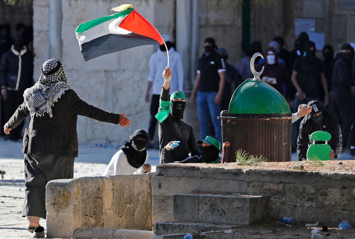 <i>AHMAD GHARABLI/AFP/Getty Images</i><br/>Palestinian demonstrators clash with Israeli police at Jerusalem's al-Aqsa mosque compound on April 15.