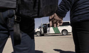 Migrants seeking asylum in the U.S. are transferred to a temporary shelter in Yuma