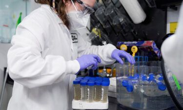 A lab technician tests wastewater samples from around the United States in Cambridge