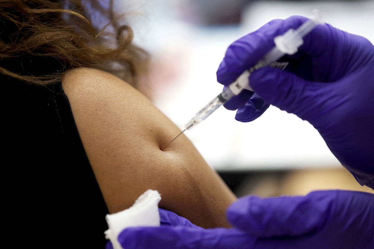 <i>Scott Olson/Getty Images</i><br/>A nurse administers a second COVID-19 booster shot to a patient at Edward Hines Jr. VA Hospital on April 1 in Hines