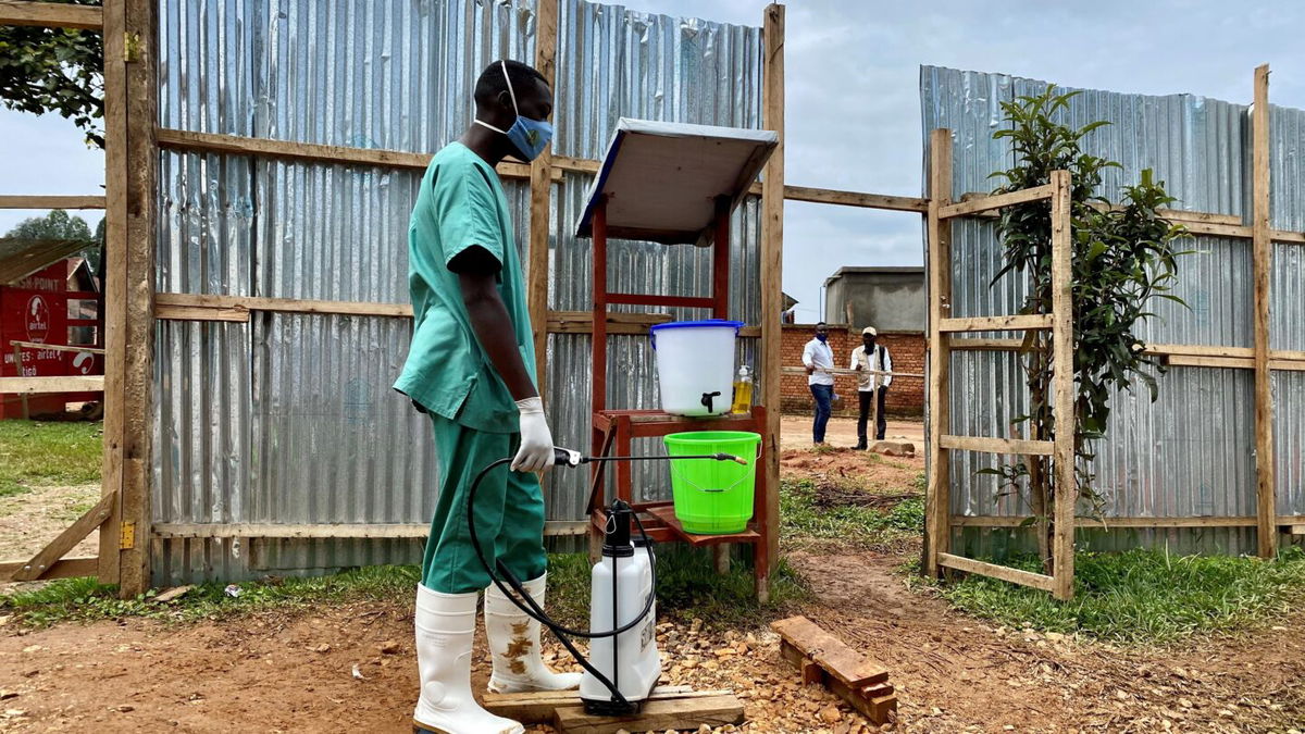 <i>Alain Uaykani/Xinhua/Getty Images</i><br/>A medical worker disinfects an Ebola treatment center on March 21