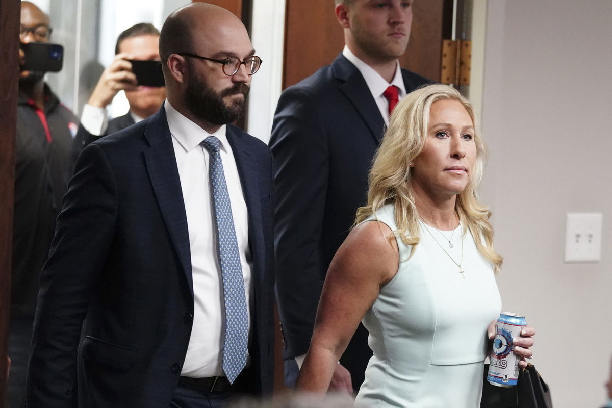 <i>John Bazemore/AP</i><br/>Rep. Marjorie Taylor Greene enters the courtroom on Friday in Atlanta.