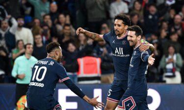 Lionel Messi (R) celebrates after opening the scoring for Paris Saint-Germain.