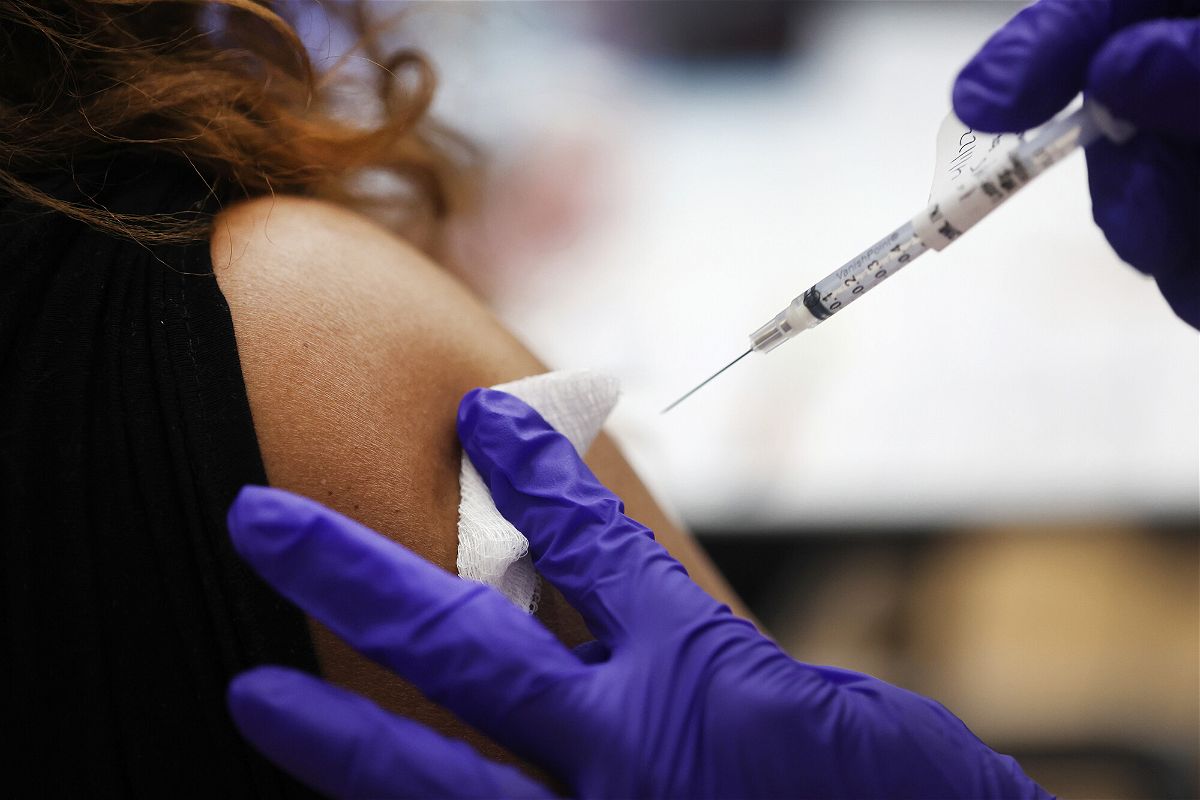<i>Scott Olson/Getty Images</i><br/>A nurse administers a second Covid-19 booster shot to a patient at Edward Hines Jr. VA Hospital on April 01