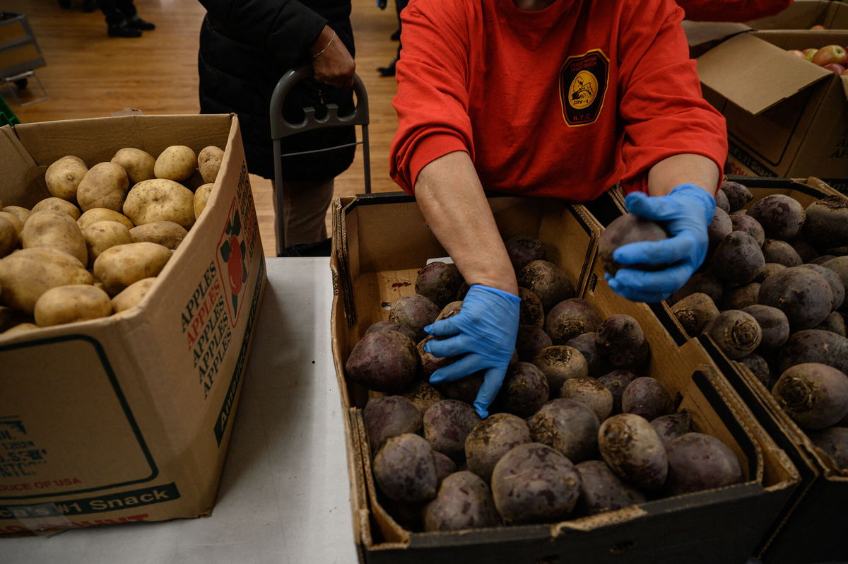 <i>Ed Jones/AFP/Getty Images</i><br/>Staff and volunteers at the Hungry Monk food pantry prepare and distribute fruit and vegetables to local residents at their church in Queens