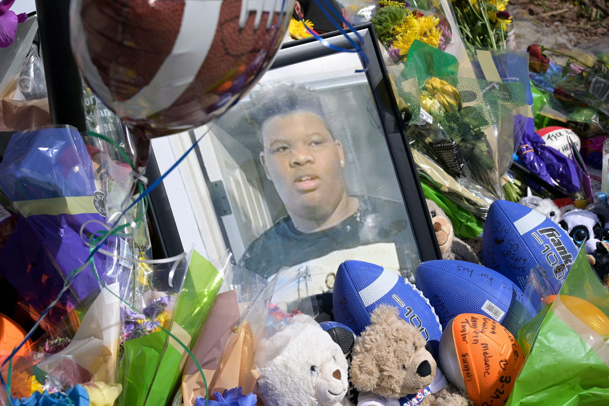 A makeshift memorial for Tyre Sampson is viewed outside the Orlando Free Fall ride at the ICON Park entertainment complex, Sunday, March 27, 2022, in Orlando, Fla. Sampson, a teenager visiting from Missouri on spring break, fell to his death while on the ride. (Phelan M. Ebenhack via AP)