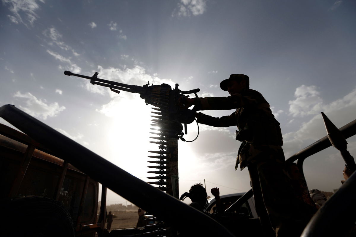 <i>MOHAMMED HUWAIS/AFP via Getty Images</i><br/>A Shiite Houthi rebel stands on a vehicle mounted with a machine-gun during a gathering to mobilise more fighters to battlefronts to fight Yemeni pro-government forces