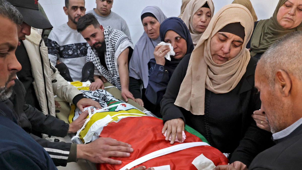 <i>HAZEM BADER/AFP/Getty Images</i><br/>The funeral of Qusai Hamamrah takes place in the West Bank village of Husan.