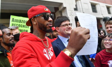 Union organizer Christian Smalls (L) celebrates with Amazon workers following the April 1vote for the unionization of the Amazon Staten Island warehouse in New York.