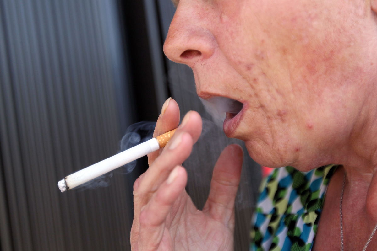 <i>Joe Raedle/Getty Images North America/Getty Images</i><br/>Brenda Wisehart smokes a menthol cigarette in front of a Quick Stop store on March 30