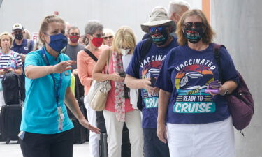 Passengers check into their cruise in Fort Lauderdale