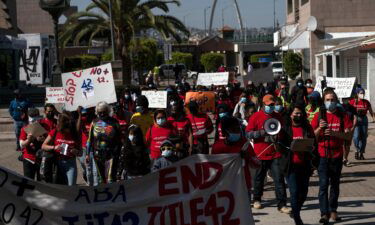 Migrants and asylum seekers march to protest against Title 42 policy heading to the Mexican side of the San Ysidro Crossing port in Tijuana