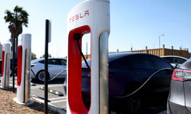 Tesla cars recharge at a Tesla Supercharger station on April 14