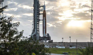 Blue sky and clouds serve as the backdrop for a sunrise view of the Artemis I Space Launch System at NASA's Kennedy Space Center in Florida on March 23.