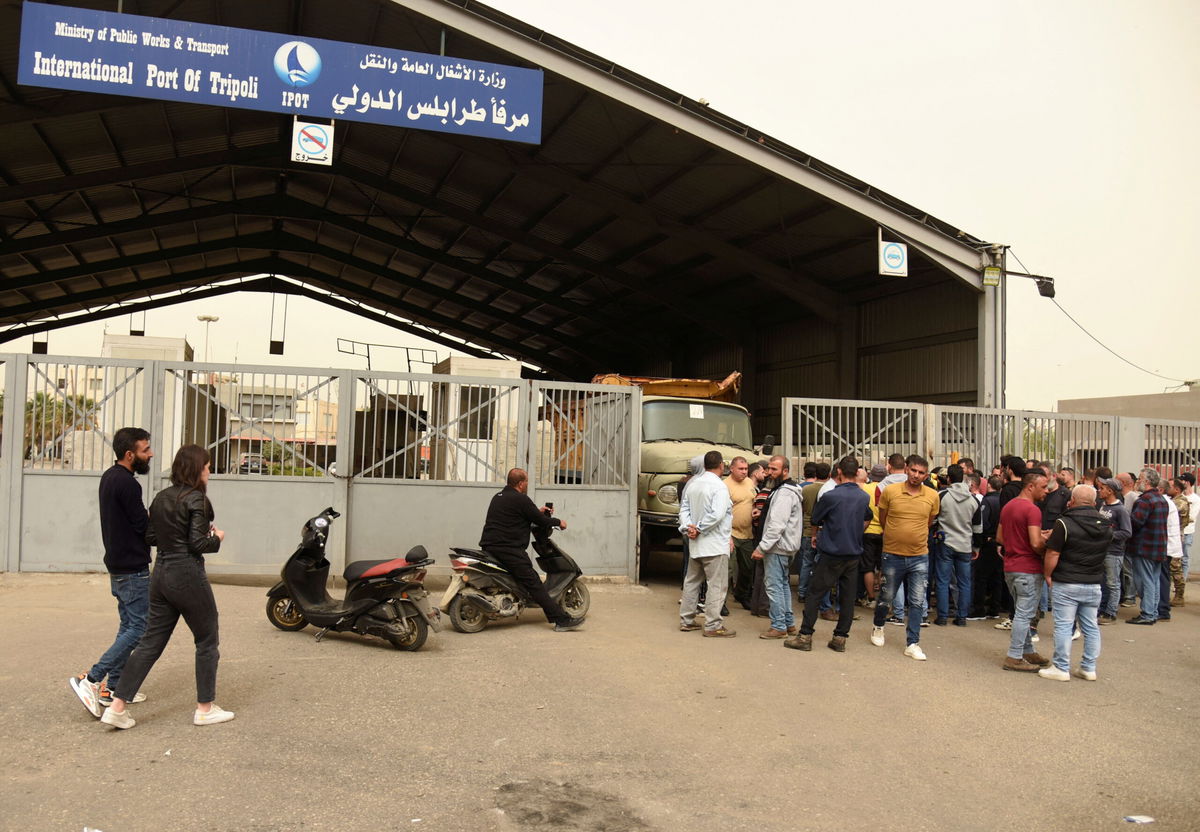 <i>Omar Ibrahim/Reuters</i><br/>Relatives of those who died when a boat capsized coast gather at the port of Tripoli