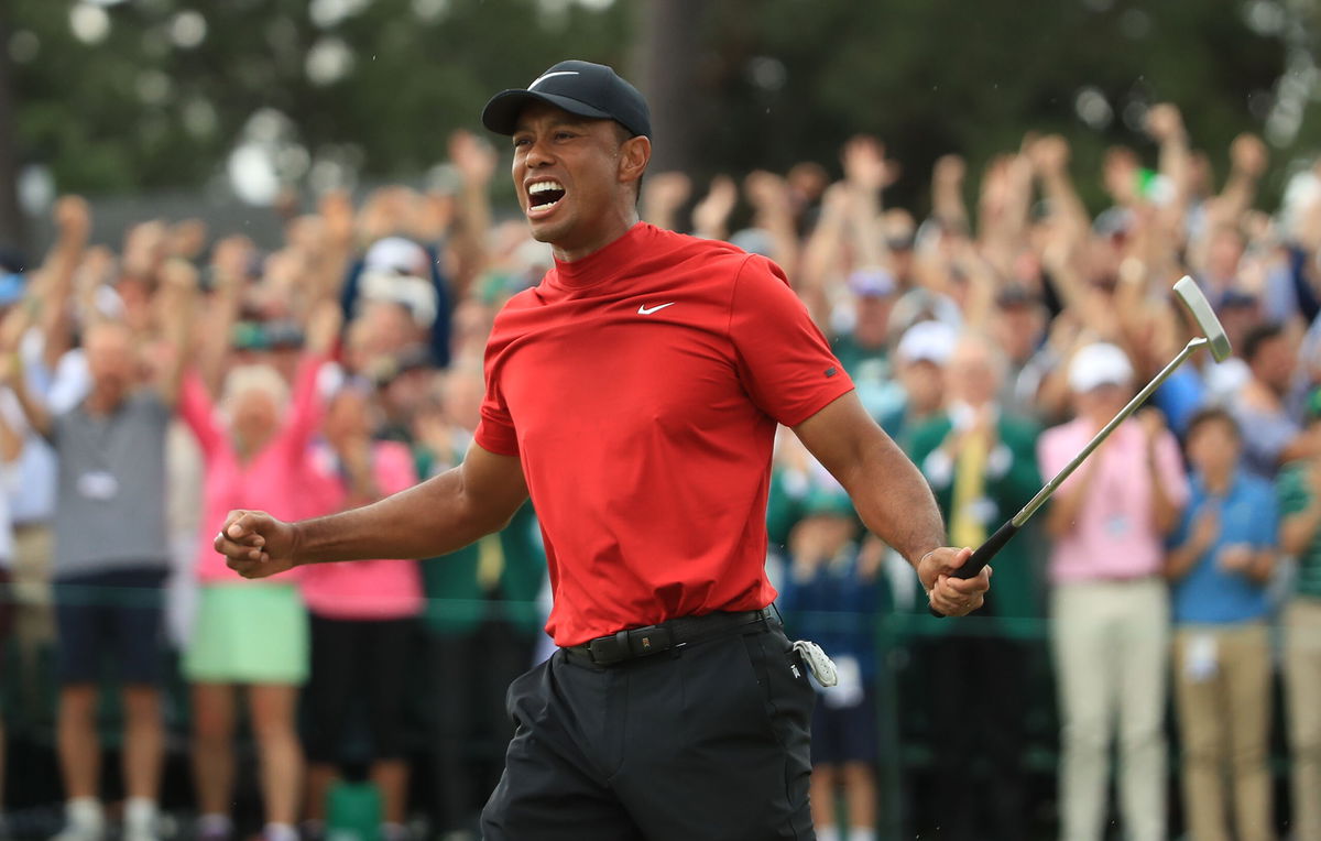 AUGUSTA, GEORGIA - APRIL 14: Tiger Woods (L) of the United States celebrates on the 18th green after winning the Masters at Augusta National Golf Club on April 14, 2019 in Augusta, Georgia. (Photo by Andrew Redington/Getty Images)