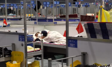 There is an outcry as Shanghai sends vulnerable senior citizens into makeshift quarantine camps.  A man is seen sleeping in a temporary hospital for people infected with Covid in Shanghai on April 19.