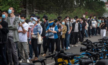 People line up for Covid tests at a makeshift testing site in Beijing's Chaoyang district on Monday.