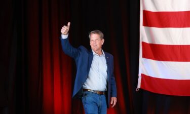 Georgia Gov. Brian Kemp walks onstage for a campaign event attended by former US Vice President Mike Pence at the Cobb County International Airport on May 23 in Kennesaw