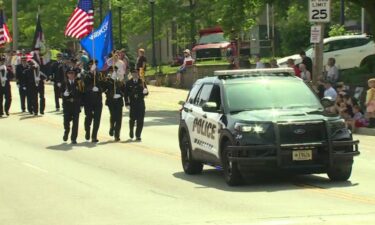 Hundreds of people lined Wisconsin Avenue in Waukesha Monday