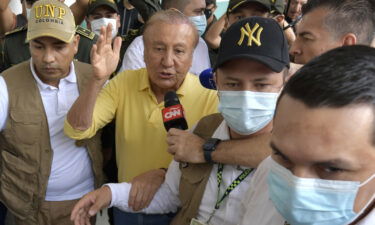 Rodolfo Hernandez leaves a polling station after voting in the presidential elections in Bucaramanga on Sunday