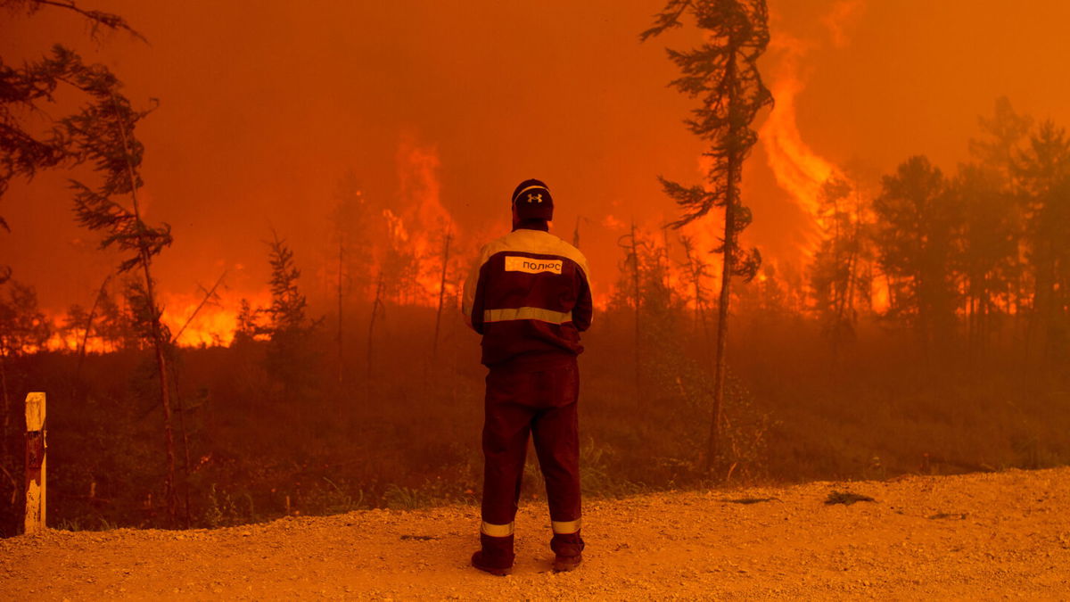 <i>Ivan Nikiforov/AP</i><br/>A forest fire near Kyuyorelyakh village at Gorny Ulus in Russia