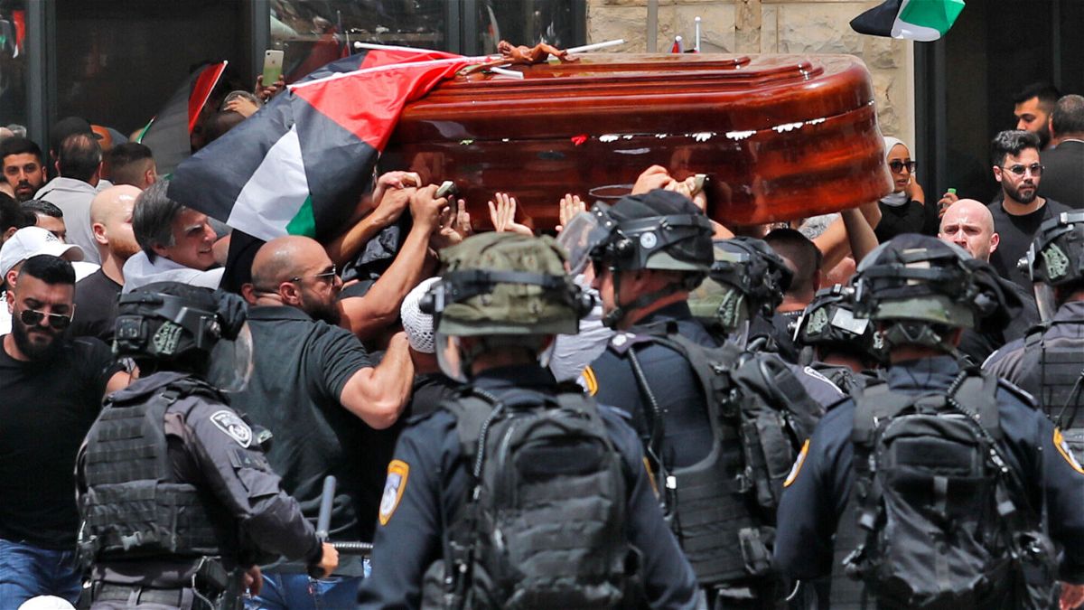 <i>AHMAD GHARABLI/AFP via Getty Images</i><br/>Violence erupts between Israeli security forces and Palestinian mourners carrying the casket of slain  Al-Jazeera journalist Shireen Abu Akleh out of a hospital