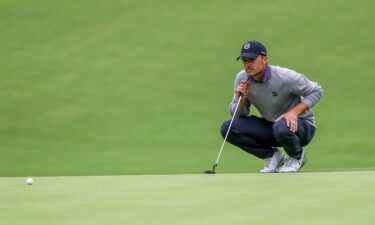 Jordan Spieth sizes up his putt on the 12th hole during the third round of the 2022 PGA Championship at Southern Hills Country Club in Tulsa