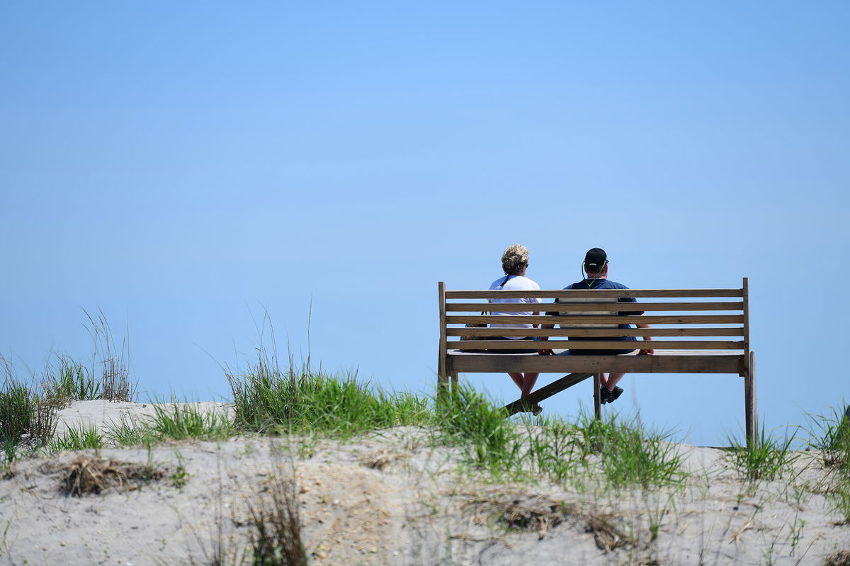 <i>Mark Makela/Getty Images</i><br/>A couple gazes towards the ocean on May 30 in Atlantic City