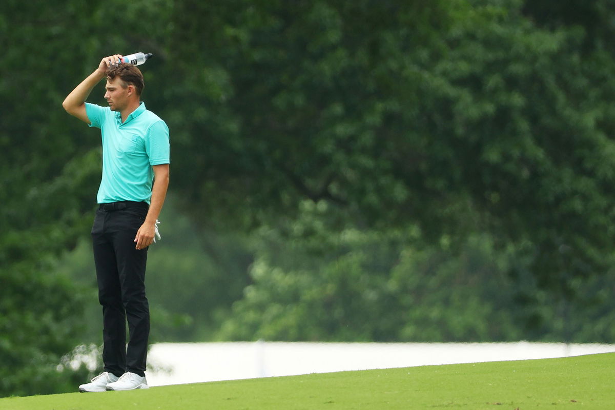 <i>Andrew Redington/Getty Images</i><br/>Wise stands on the seventh hole after being hit by Smith's ball.