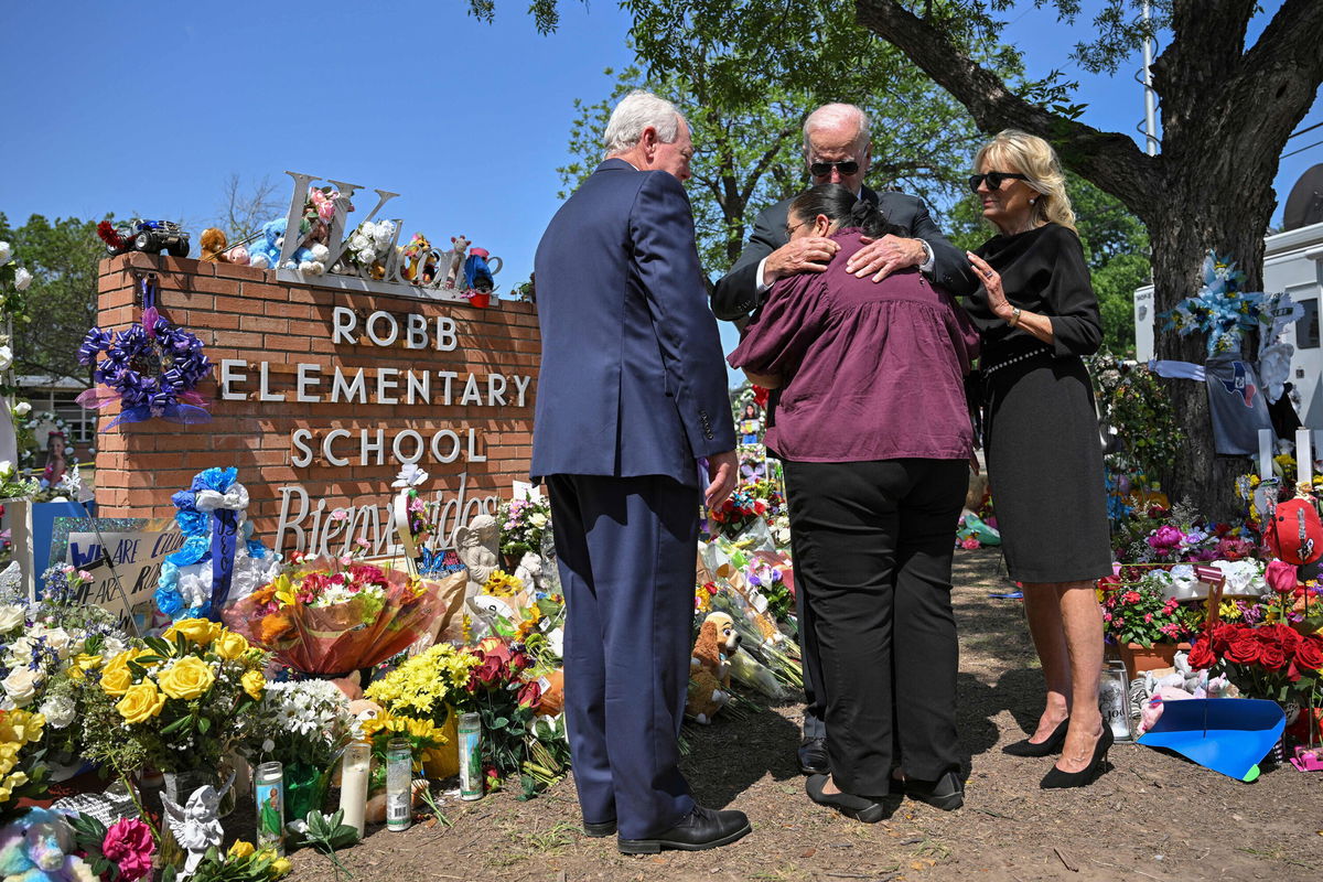 <i>Mandel Ngan/AFP/Getty Images</i><br/>President Joe Biden embraces Mandy Gutierrez