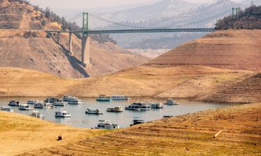 Houseboats sit in a narrow section of water in a depleted Lake Oroville in California on September 5