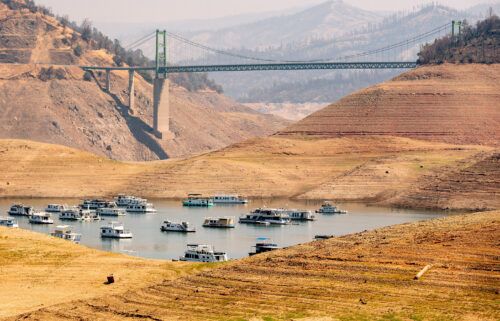 Houseboats sit in a narrow section of water in a depleted Lake Oroville in California on September 5