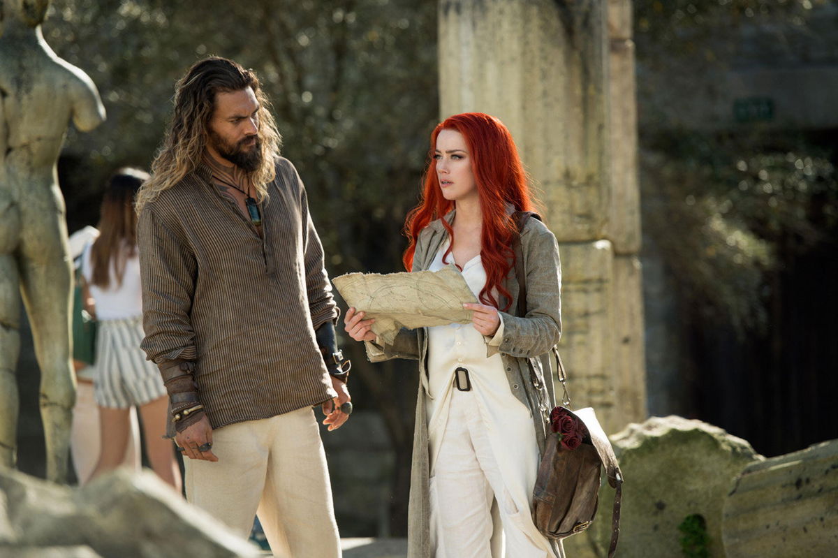 <i>Warner Bros/Moviestore/Shutterstock</i><br/>Jason Momoa and Amber Heard in 2018's 