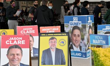 Voters queue up outside a pre-polling station in Berala electorate of Sydney on May 19.