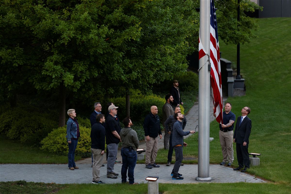 <i>Edgar Su/Reuters</i><br/>The US flag is raised for the first time after American diplomats returned to the US embassy in Kyiv