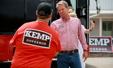 Republican Gov. Brian Kemp greets people as he campaigns in Watkinsville