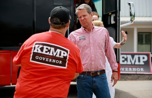 Republican Gov. Brian Kemp greets people as he campaigns in Watkinsville